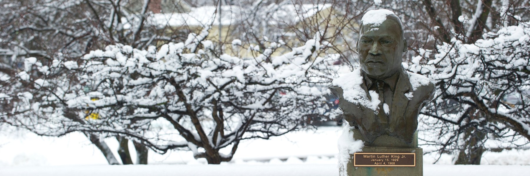 a statue bust of MLK Jr covered in snow