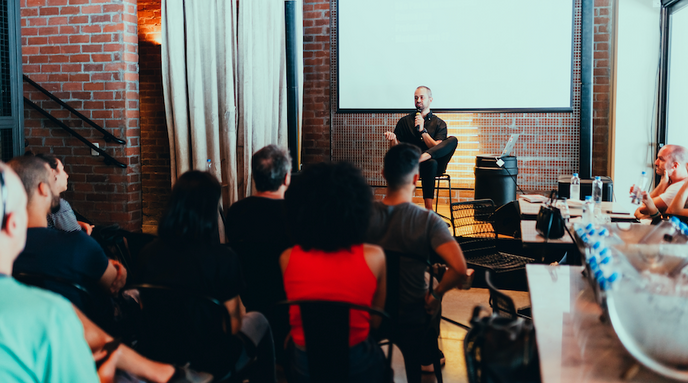 a person giving a presentation in front of a group of people