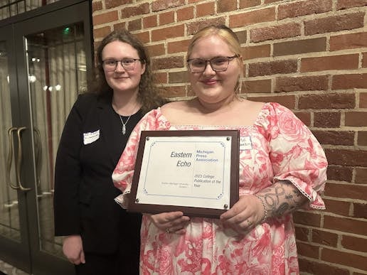 Content Editor Victoria Smith (left) and Editor-in-Chief Marie White (right) pose for a photo with their Michigan Press Association award after the ceremony.