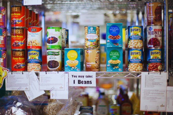 canned goods are displayed on shelves in a store