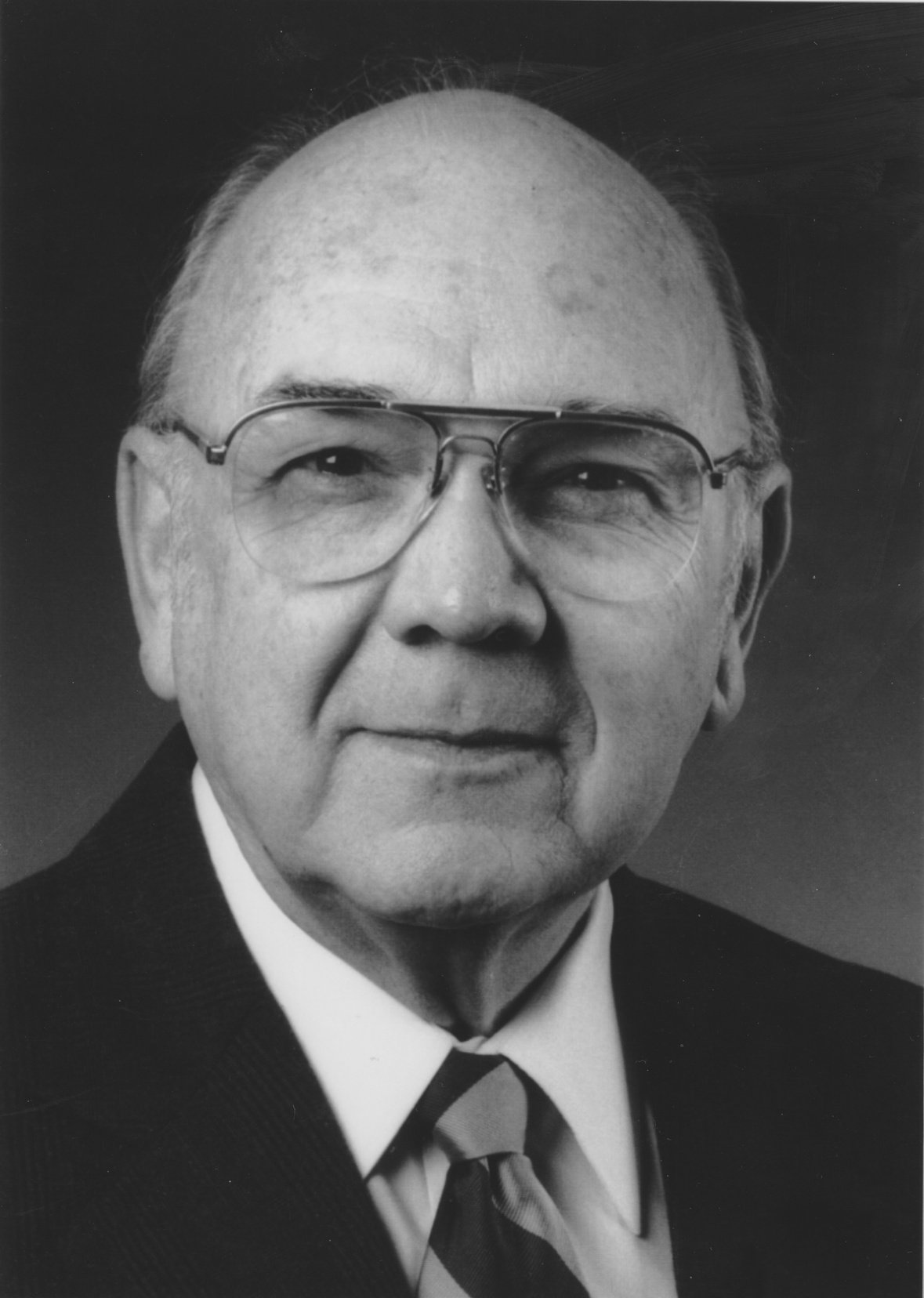 A black and white professional headshot of Professor James H. Conley