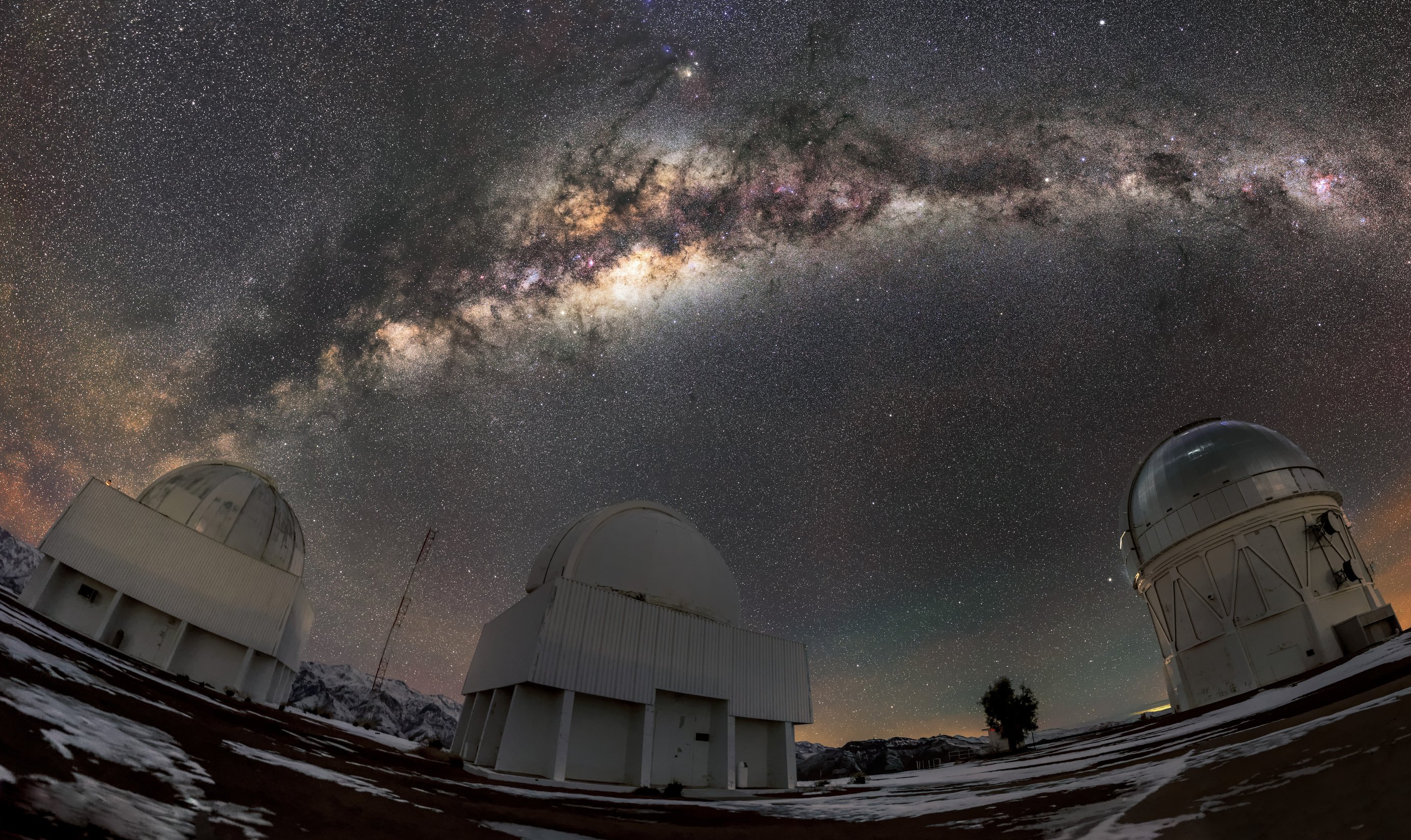 An upward view of the start-filled night sky over the Curtis Schmidt telescope in the Andes Mountains 