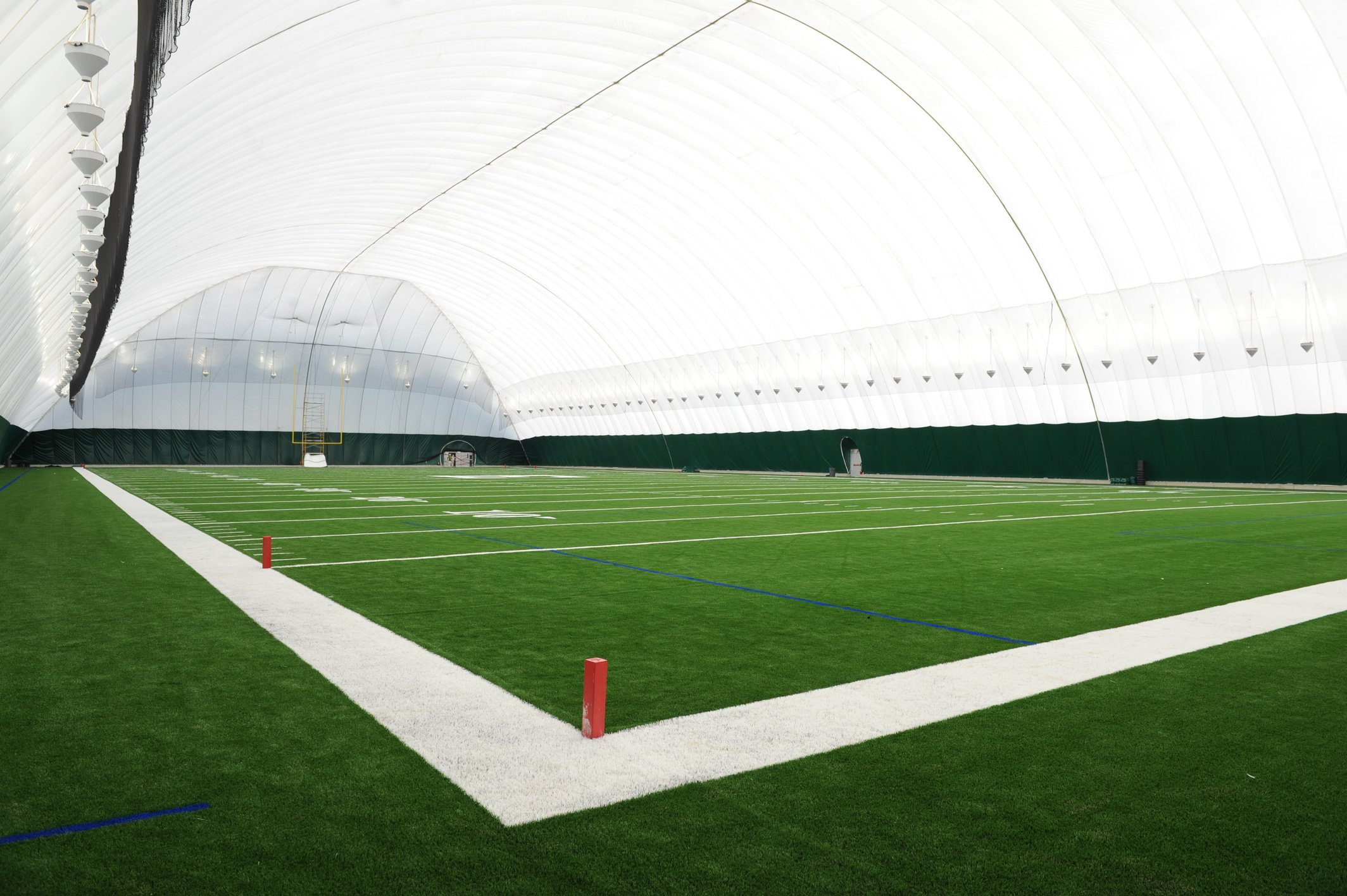 an indoor football field inside of a large dome