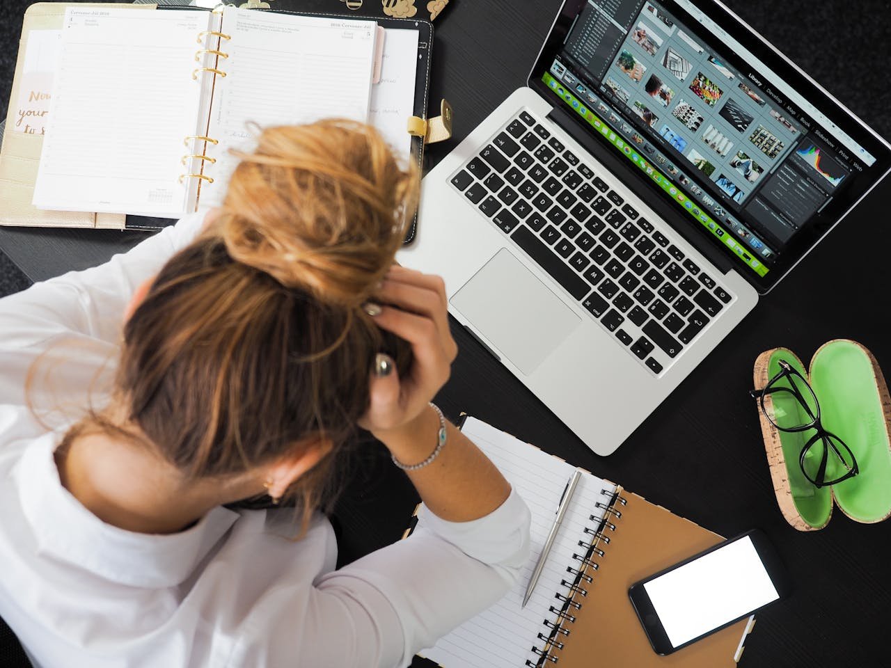 A student sits tiredly at a computer