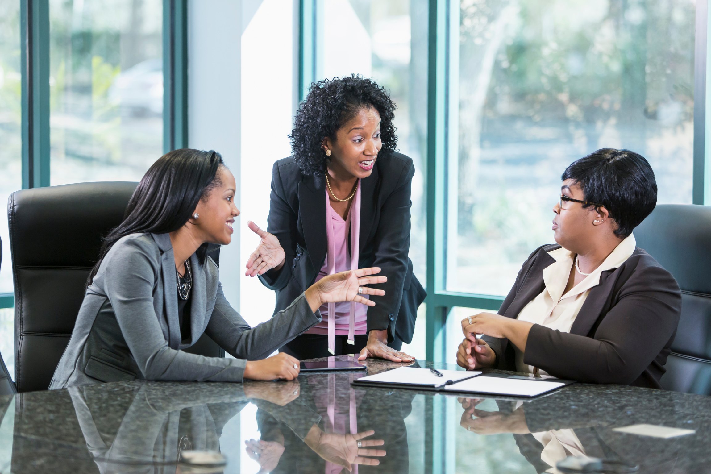 Three black women in business meeting